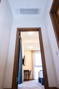 Voodi või voodid majutusasutuse Rooftop Hotel toas