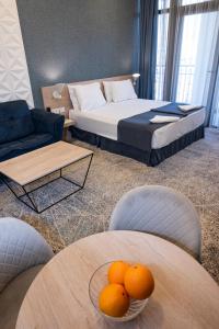 Voodi või voodid majutusasutuse Rooftop Hotel toas