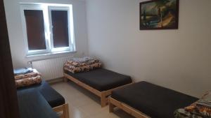 Posezení v ubytování Domek wśród drzew - noclegi