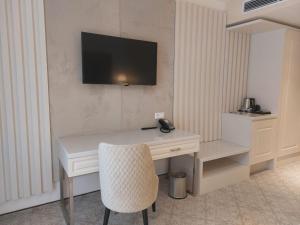TV a/nebo společenská místnost v ubytování Hotel Arcade
