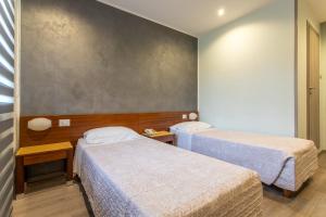 Postel nebo postele na pokoji v ubytování Hotel San Giorgio