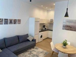 a living room with a couch and a table at Apartamento Murcia San José C in Murcia