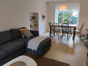 a living room with a couch and a table at Casa Gaztelu Txiki in Irún