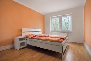 a bedroom with a bed and a window at Meer-Natur-Idyll in Peenemünde