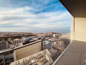 a view of the city from a building at Sea view Mercury Tower, Rooftop infinity Pool in St. Julianʼs
