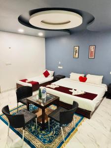 Ліжко або ліжка в номері The Elite Beachview