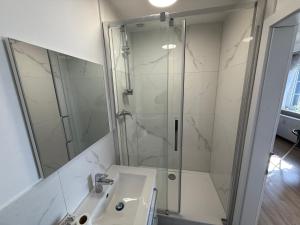 a bathroom with a shower and a sink at Apartments in Garbsen in Garbsen