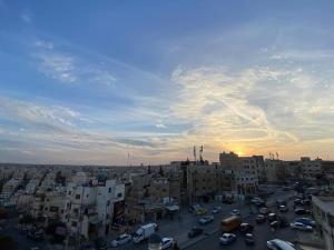 a view of a city with cars and buildings at Osama Alnaser in Amman
