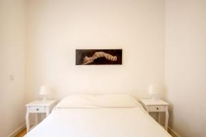 Postel nebo postele na pokoji v ubytování GuestReady - Peaceful haven in Sesimbra