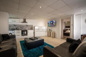 a living room with a couch and a table at Luxury 1bed - Contractors Welcome - Fast WiFi in Cleethorpes