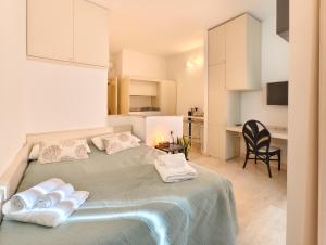 Postel nebo postele na pokoji v ubytování Oidu - Cagliari Suites