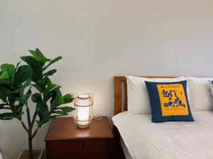 Postel nebo postele na pokoji v ubytování Sea Fun Homestay