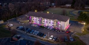 an aerial view of a building with a parking lot at College Inn in Oxford