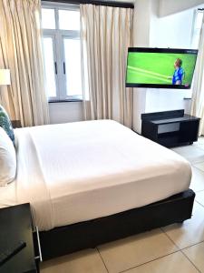TV a/nebo společenská místnost v ubytování Parade Hotel