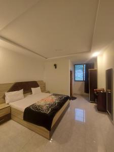 Postel nebo postele na pokoji v ubytování Farooq hotel + 18 fotografií