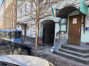 a car parked outside of a building with a door at Apart-Hotel IGORIVSKA in Kyiv