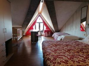 A bed or beds in a room at Albergo Sella - Monte Amiata