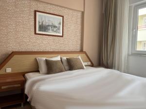 Postel nebo postele na pokoji v ubytování Agora Boutique Apart Hotel