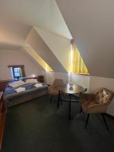 Postel nebo postele na pokoji v ubytování Apartmány BAROKO