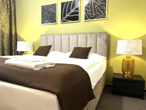 Posteľ alebo postele v izbe v ubytovaní Hotel Zlatý Býk