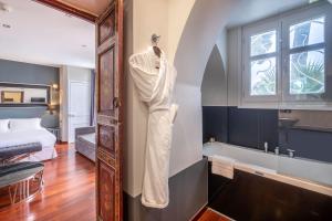 a robe hanging on a wall in a room at La Villa Mauresque in Saint-Raphaël