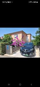 a black car parked in front of a house at Morena in Pula