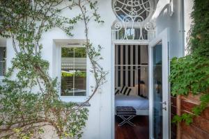 a door leading into a bedroom with a bed at La Villa Mauresque in Saint-Raphaël