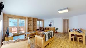 a living room with a couch and a table at Les Mayens MA 011 - LUXURY apartment 6 pers in Veysonnaz