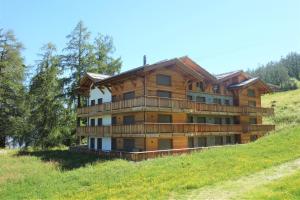 a large wooden house on a hill at Les Mayens MA 011 - LUXURY apartment 6 pers in Veysonnaz