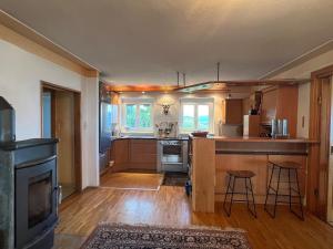 a kitchen with a stove and a counter top at Mountain house with a view in Christofberg