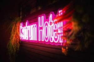 a neon sign that says carolina farmhouse on a building at Centrum Hotel in Akureyri
