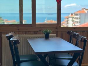 a table and two chairs in front of a window at İnebolu Eskonak Otel in Inebolu +38 photos
