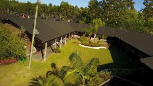 an overhead view of a house with a yard at HOTEL Bambys Lodge in Concordia