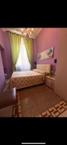 A bed or beds in a room at Guest House Biondi