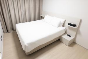 Postel nebo postele na pokoji v ubytování Hotel Wavellent Yangyang