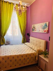 A bed or beds in a room at Guest House Biondi