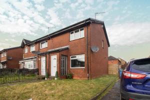 a brick house with a car parked in front of it at Spacious 2-Bed City Home Free Parking & Stadiums in Glasgow