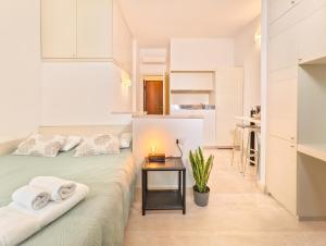 Postel nebo postele na pokoji v ubytování Oidu - Cagliari Suites