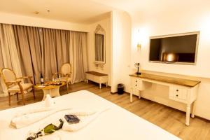 Postel nebo postele na pokoji v ubytování Leonardo Hotel Negev