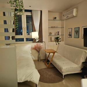 Posezení v ubytování JJ Cozy APT Seoul
