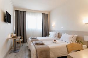 TV a/nebo společenská místnost v ubytování Nestos Hotel