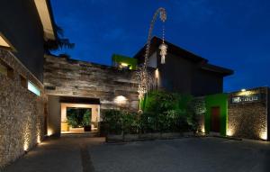 a building at night with a building with lights at Cicada Luxury Townhouses in Seminyak