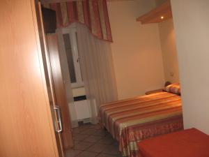 A bed or beds in a room at Parco Sogni d'Oro Még 37 kép