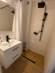 a bathroom with a sink and a shower at Avalon Lux in Sunny Beach