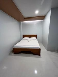 Ένα ή περισσότερα κρεβάτια σε δωμάτιο στο RUBY Suites