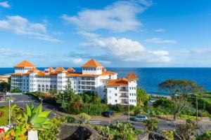 a view of a resort with the ocean in the background at BoLina Ocean View in Caniço