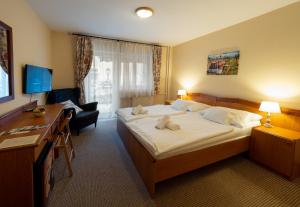 Posteľ alebo postele v izbe v ubytovaní Hotel Cabernet