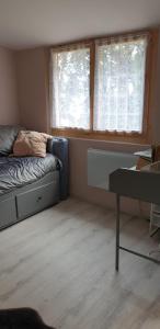 Postel nebo postele na pokoji v ubytování Mini châlet vue mer