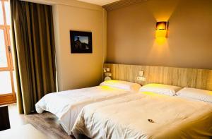 Postel nebo postele na pokoji v ubytování Hotel Gran Casona de Sanabria