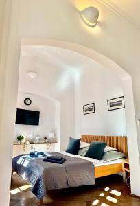Posteľ alebo postele v izbe v ubytovaní Apartmány Nerudova 36